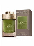 Maison Glitter Bvlgari Man Wood Essence Eau de Parfum for men, 100ml bottle with green liquid and gold cap, alongside its grey box.